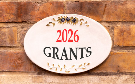 2026 Grants symbol. Concept words 2026 Grants on beautiful white sign. Beautiful old brown brick...