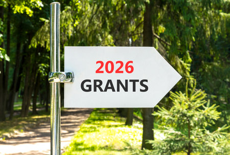 2026 Grants symbol. Concept words 2026 Grants on beautiful white road sign. Beautiful summer green forest garden background. Business and 2026 grants concept. Copy space.の写真素材