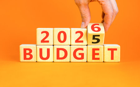 2026 Budget symbol. Concept words 2026 Budget on beautiful wooden blocks. Beautiful orange paper...