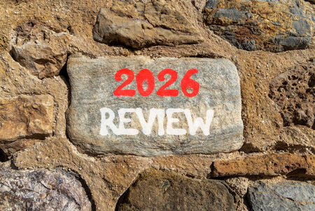 2026 Review symbol. Concept words 2026 Review on beautiful gray stone on stone wall. Beautiful stone...