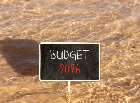 Budget 2026 symbol. Concept words Budget 2026 on beautiful black blackboard. Beautiful Red sea water...