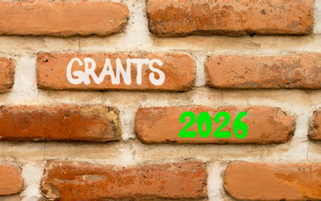 Grants 2026 symbol. Concept words Grants 2026 on beautiful brown brick wall. Beautiful brown brick...