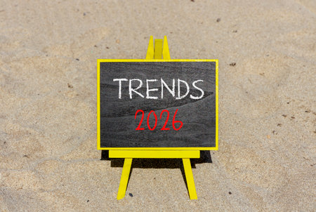 Trends 2026 new year symbol. Concept words Trends 2026 on beautiful black blackboard. Beautiful sand beach background. Business and Trends 2026 new year concept. Copy space.の写真素材