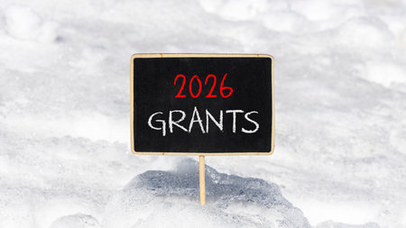 2026 Grants symbol. Concept words 2026 Grants on beautiful black blackboard. Beautiful white snow...