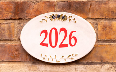 Business concept of 2026 new year symbol. Concept number 2026 on beautiful white road sign. Beautiful old brown brick wall background. Business 2026 concept. Copy space.の写真素材