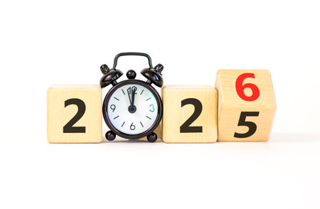 Business concept of 2026 new year symbol. Beautiful turned wooden cube and changed number 2025 to...