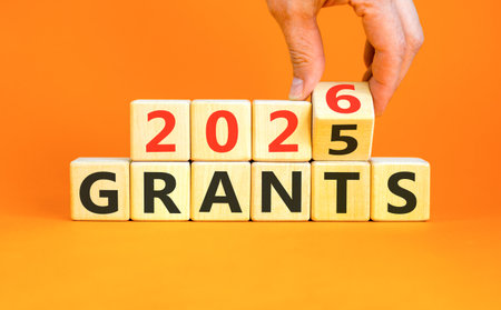 2026 Grants symbol. Concept words 2026 Grants on beautiful wooden blocks. Beautiful orange paper...