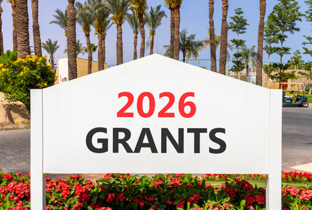 2026 Grants symbol. Concept words 2026 Grants on beautiful white road sign. Beautiful palm trees...