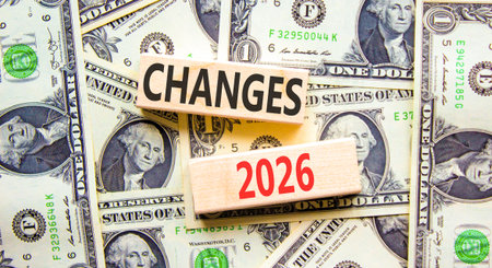 Changes 2026 symbol. Concept words Changes 2026 on beautiful wooden blocks. Beautiful dollar bills...