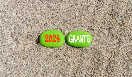 2026 Grants symbol. Concept words 2026 Grants on beautiful green stones on sand beach. Beautiful...
