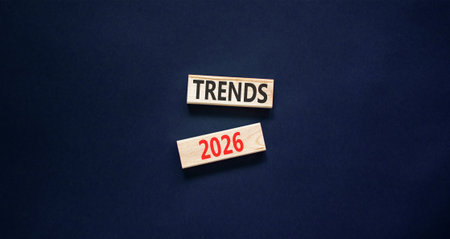 Trends 2026 new year symbol. Concept words Trends 2026 on wooden blocks. Black paper background....