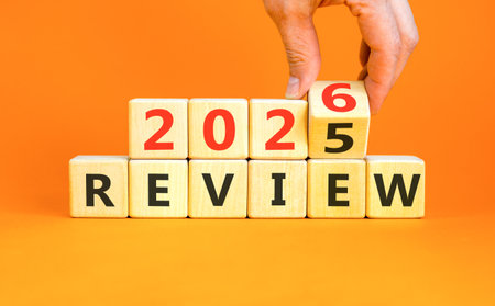 2026 Review symbol. Concept words 2026 Review on beautiful wooden blocks. Beautiful orange paper...