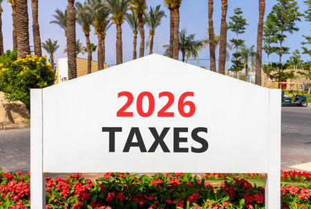 2026 taxes new year symbol. Concept words 2026 taxes on beautiful white road sign. Beautiful palm...