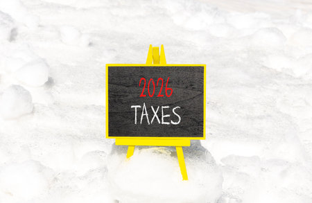 2026 taxes new year symbol. Concept words 2026 taxes on beautiful black blackboard. Beautiful white...