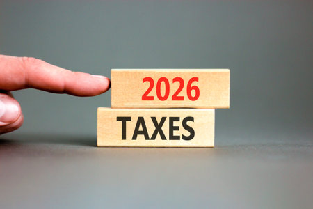 2026 taxes new year symbol. Concept words 2026 taxes on beautiful wooden blocks. Beautiful gray...