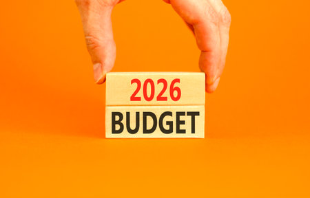 2026 Budget symbol. Concept words 2026 Budget on beautiful wooden blocks. Beautiful orange paper...