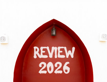 Review 2026 symbol. Concept words Review 2026 on beautiful white and red wall. Beautiful white and...