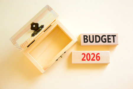 Budget 2026 symbol. Concept words Budget 2026 on beautiful wooden blocks. Beautiful white paper...