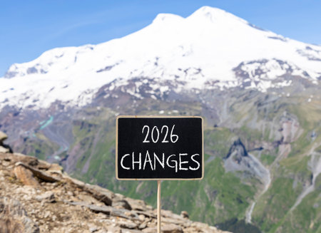 2026 Changes symbol. Concept words 2026 Changes on beautiful black blackboard. Beautiful mountain Elbrus and blue sky background. Business and 2026 changes concept. Copy space.の写真素材