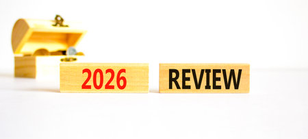 2026 Review symbol. Concept words 2026 Review on beautiful wooden blocks. Beautiful white paper...