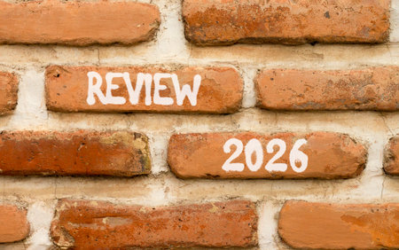 Review 2026 symbol. Concept words Review 2026 on beautiful brown brick wall. Beautiful brown brick...