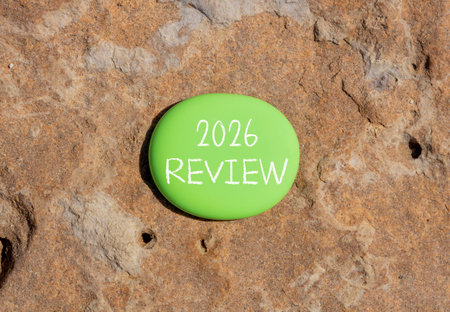 2026 Review symbol. Concept words 2026 Review on beautiful green stone. Beautiful brown stone background. Business and 2026 review concept. Copy space.の写真素材