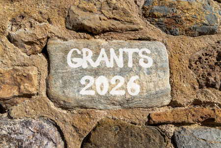 Grants 2026 symbol. Concept words Grants 2026 on beautiful gray stone on stone wall. Beautiful stone wall background. Business and grants 2026 concept. Copy space.の写真素材