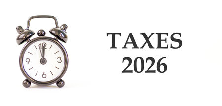 Taxes 2026 new year symbol. Concept words Taxes 2026 on beautiful white paper. Beautiful white paper...