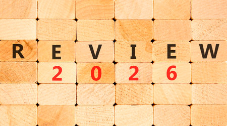 Review 2026 symbol. Concept words Review 2026 on beautiful wooden blocks wall. Beautiful wooden blocks wall background. Business and review 2026 concept. Copy space.の写真素材