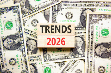 Trends 2026 new year symbol. Concept words Trends 2026 on beautiful wooden blocks. Beautiful dollar bills background. Dollar bills. Business and Trends 2026 new year concept. Copy space.の写真素材