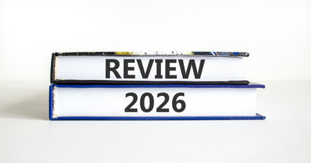 Review 2026 symbol. Concept words Review 2026 on beautiful books. Beautiful white paper background....