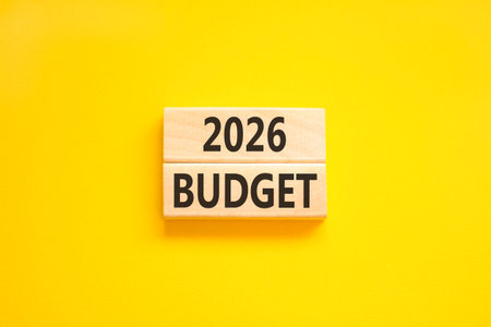 2026 Budget symbol. Concept words 2026 Budget on beautiful wooden blocks. Beautiful yellow paper background. Business and 2026 budget concept. Copy space.の写真素材