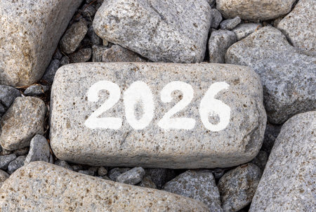 Business concept of 2026 new year symbol. Concept number 2026 Happy new year on beautiful gray stone. Beautiful gray stones beach background. Business 2026 happy new year concept. Copy space.の写真素材