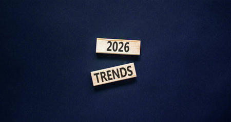 2026 Trends new year symbol. Concept words 2026 Trends on beautiful wooden blocks. Beautiful black paper background. Business and 2026 Trends new year concept. Copy space.の写真素材