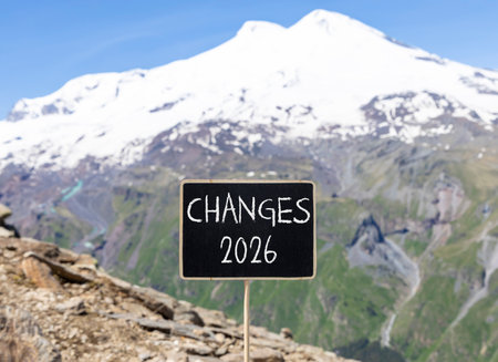 Changes 2026 symbol. Concept words Changes 2026 on beautiful black blackboard. Beautiful mountain Elbrus and blue sky background. Business and changes 2026 concept. Copy space.の写真素材