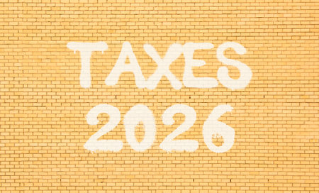Taxes 2026. Concept words Taxes 2026 on beautiful old brown brick wall. Beautiful old brown brick wall background. Business and taxes 2026 concept. Copy space.の写真素材