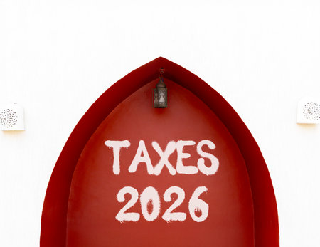 Taxes 2026 new year symbol. Concept words Taxes 2026 on beautiful white and red wall. Beautiful white and red wall background. Business and taxes 2026 new year concept. Copy space.の写真素材