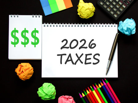 2026 taxes new year symbol. Concept words 2026 taxes on beautiful white note. Beautiful black paper...