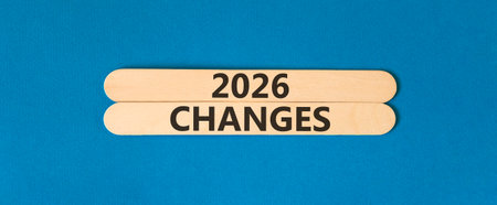 2026 Changes symbol. Concept words 2026 Changes on beautiful wooden sticks. Beautiful blue paper...