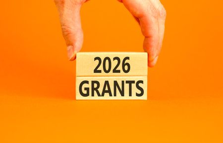 2026 Grants symbol. Concept words 2026 Grants on beautiful wooden blocks. Beautiful orange paper...