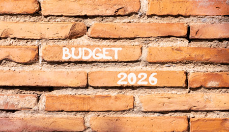 Budget 2026 symbol. Concept words Budget 2026 on beautiful brown brick wall. Beautiful brown brick wall background. Business and budget 2026 concept. Copy space.の写真素材