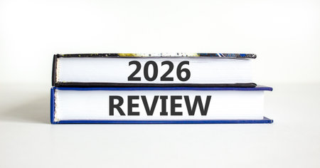 2026 Review symbol. Concept words 2026 Review on beautiful books. Beautiful white paper background....