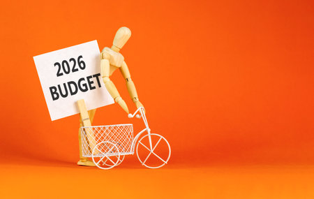 2026 Budget symbol. Concept words 2026 Budget on beautiful white card. Beautiful orange paper background. Businessman's model. Business and 2026 budget concept. Copy space.の写真素材