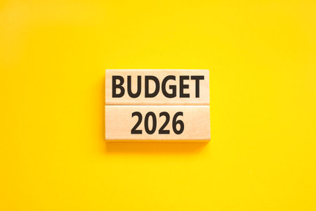 Budget 2026 symbol. Concept words Budget 2026 on beautiful wooden blocks. Beautiful yellow paper...