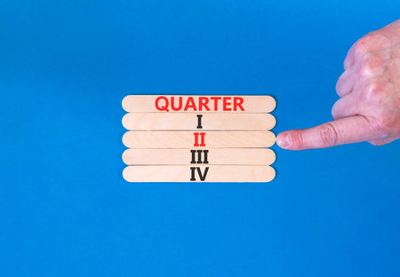 2nd second quarter 2 symbol. Concept word Quarter 2 on beautiful wooden sticks. Beautiful blue...
