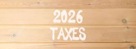 2026 taxes new year symbol. Concept words 2026 taxes on beautiful wooden wall. Beautiful wooden wall background. Business and 2026 taxes new year concept. Copy space.の写真素材