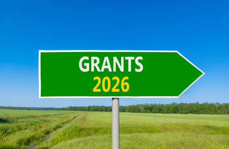 Grants 2026 symbol. Concept words Grants 2026 on beautiful green road sign. Beautiful green grass...