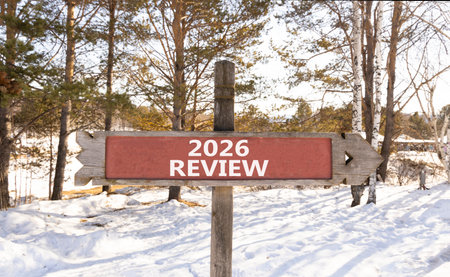 2026 Review symbol. Concept words 2026 Review on beautiful wooden road sign. Beautiful winter forest...