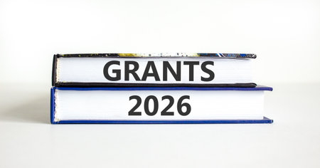 Grants 2026 symbol. Concept words Grants 2026 on beautiful books. Beautiful white paper background....