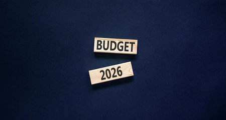 Budget 2026 symbol. Concept words Budget 2026 on beautiful wooden blocks. Beautiful black paper background. Business and budget 2026 concept. Copy space.の写真素材